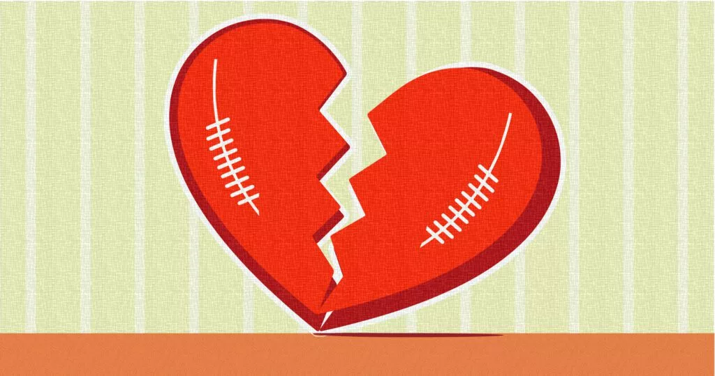 art of a two footballs shaped like a broken heart illustrating how some fans end their relationship with the nfl due to politics