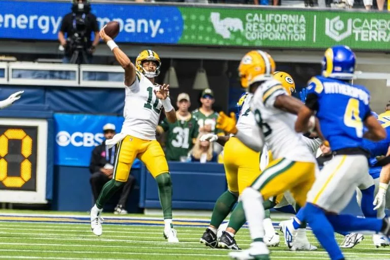 Green Bay Packers quarterback Jordan Love passes the ball