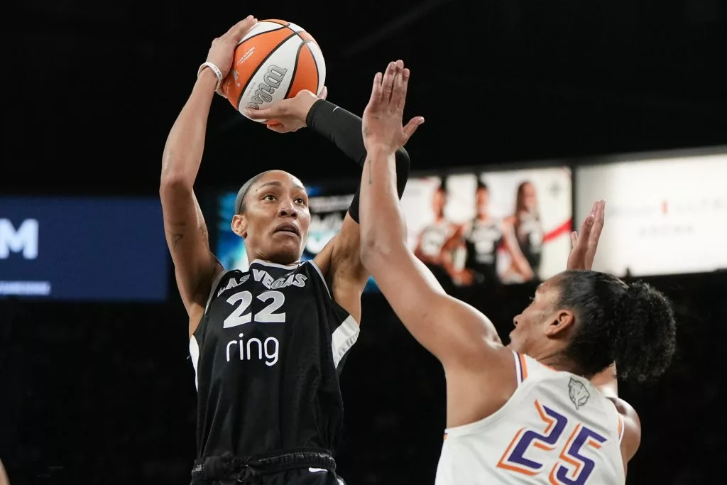 Oct 5, 2025; Las Vegas, Nevada, USA; Las Vegas Aces center A'ja Wilson (22) shoots the ball against Phoenix Mercury forward Alyssa Thomas (25) during the fourth quarter of game two of the 2025 WNBA Finals at Michelob Ultra Arena. Mandatory Credit: Lucas Peltier-Imagn Images