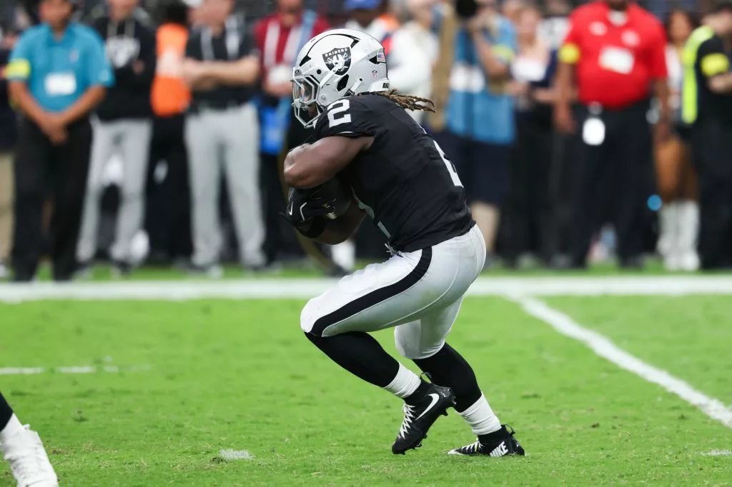 Sep 28, 2025; Paradise, Nevada, USA; Las Vegas Raiders running back Ashton Jeanty (2) runs the ball during the second half against the Chicago Bears at Allegiant Stadium. Mandatory Credit: Kiyoshi Mio-Imagn Images