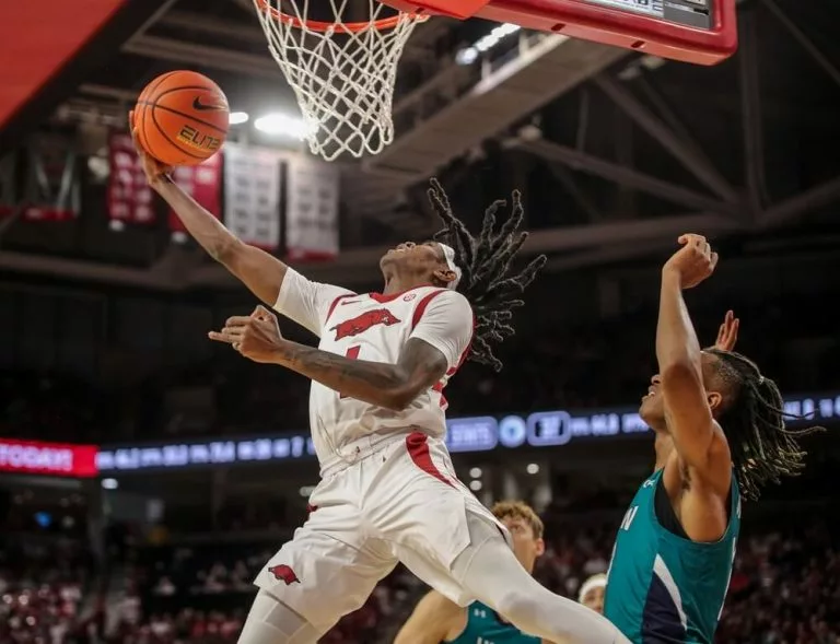 Dec 30, 2023:NCAA Mens' Basketball, UNCW 90:106 Ark- Razorbacks G Keyon Menifield Jr. (1) laysup during the game at Bud Walton Arena, Fayetteville, AR.