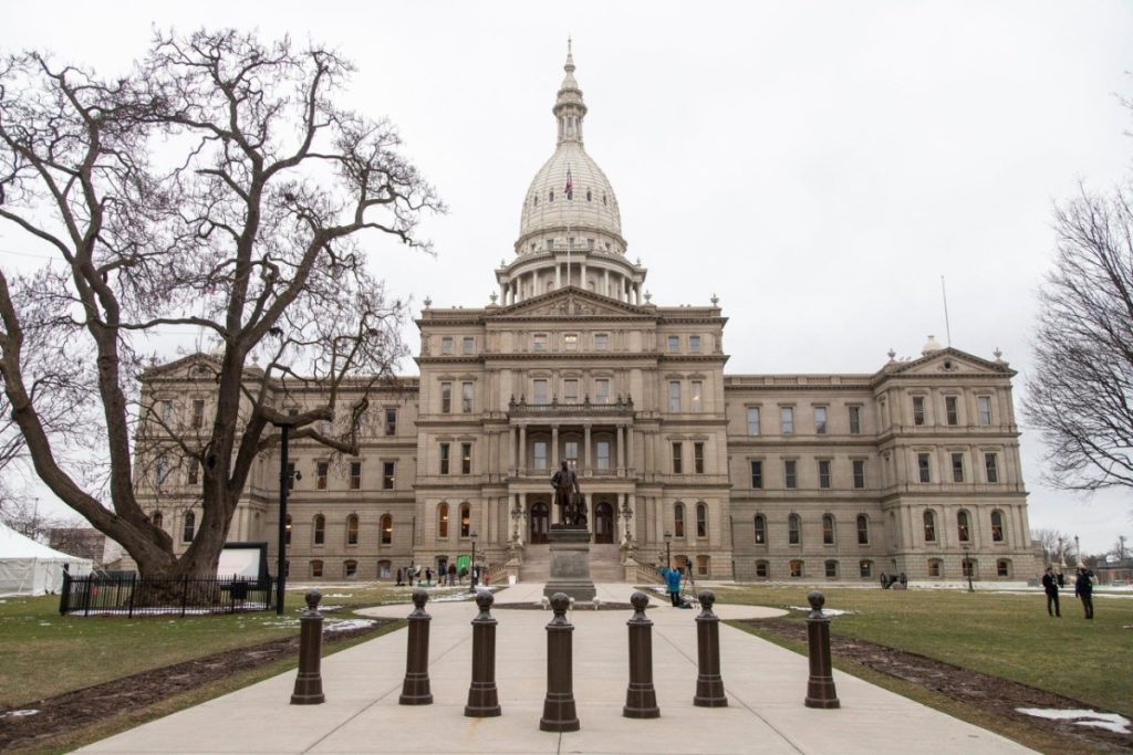 Michigan State Capitol building in Lansing - Coinbase stops event contracts in Michigan